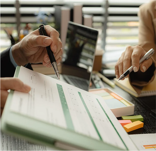 Accounting doing a bank reconciliation with a printed excel sheet
