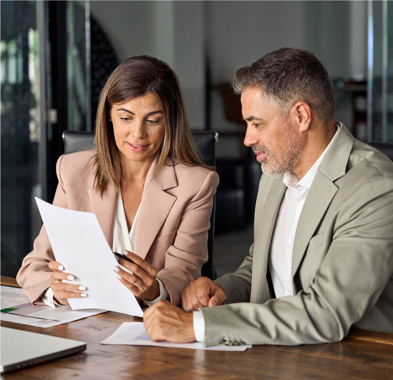 People looking at income statement People looking at income statement